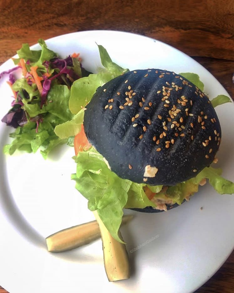 Try something twisted this #Tuesday with this black beauty from @oneoeightcafe 😜
.
📸 : @puneri_shutterbug
.
In the photo - Special Burger at One O Eight Lifestyle Café, Koregoan Park
.
#blackburger #oneoeightcafe
#thepunefoodie