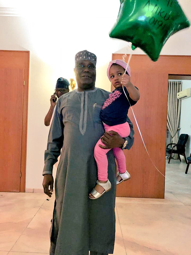 atiku's tweet image. Finally home from the primaries. Was welcomed home by my granddaughter. I’m now walking around the house with an #Atiku2019 balloon #smile