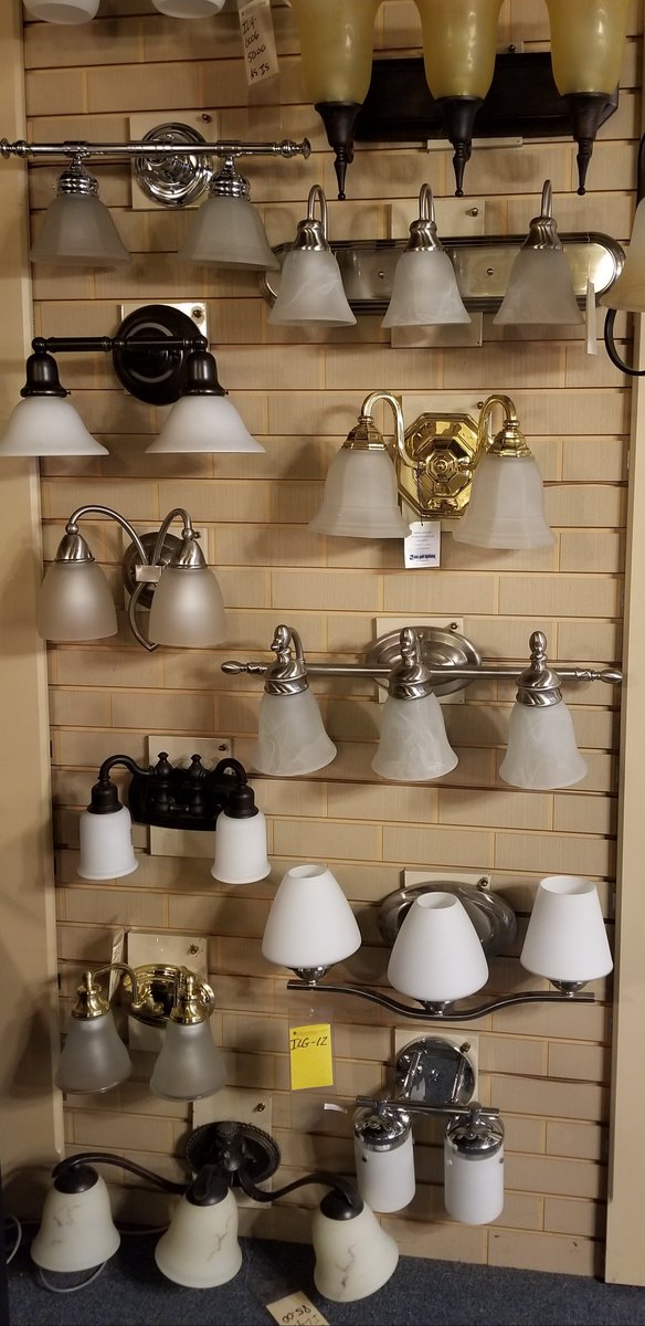 We are clearing our showroom of discontinued fixtures to make room for new product. We are offering these 2 and 3 light vanity fixtures shown on this wall only for $30 each! These fixtures are display models and will be sold As Is. Qty available is 1 of each fixture.