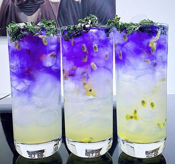 For instagrammer <a href="/onedrinkaday/">weight managment drinks.</a>, it's a passion! Reinventing the classic #GnT deliciously, and artfully. Here, it's a mix of gin, tonic fresh passion fruit and thyme-infused Blue-Tee butterfly pea flower tea. 💙💜 #ginandtonic #purple #cocktails #mixology #craftcocktails