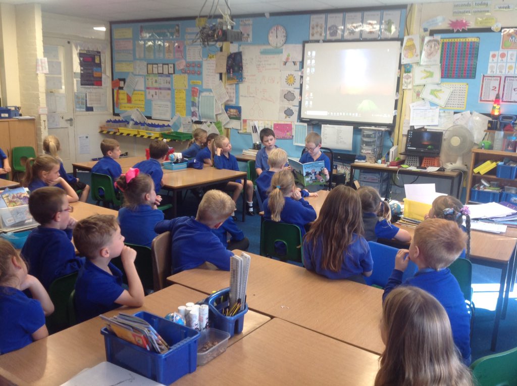 yfpsyr2's tweet photo. A year 2 child reading 'A Squash and a Squeeze' to year 2. Then the whole class spent time discussing the story in small groups. https://t.co/MhVEGSO33O