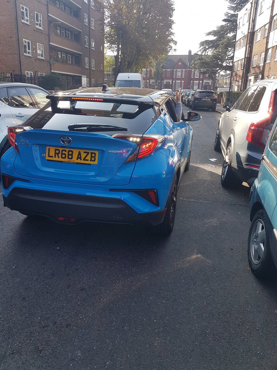 Driver floors it at speed down Springfield Road E5 and nearly knocks me over on my bike. He reverses back to confront me then, due to causing traffic, drives off calling me an immigrant to go back to my country.