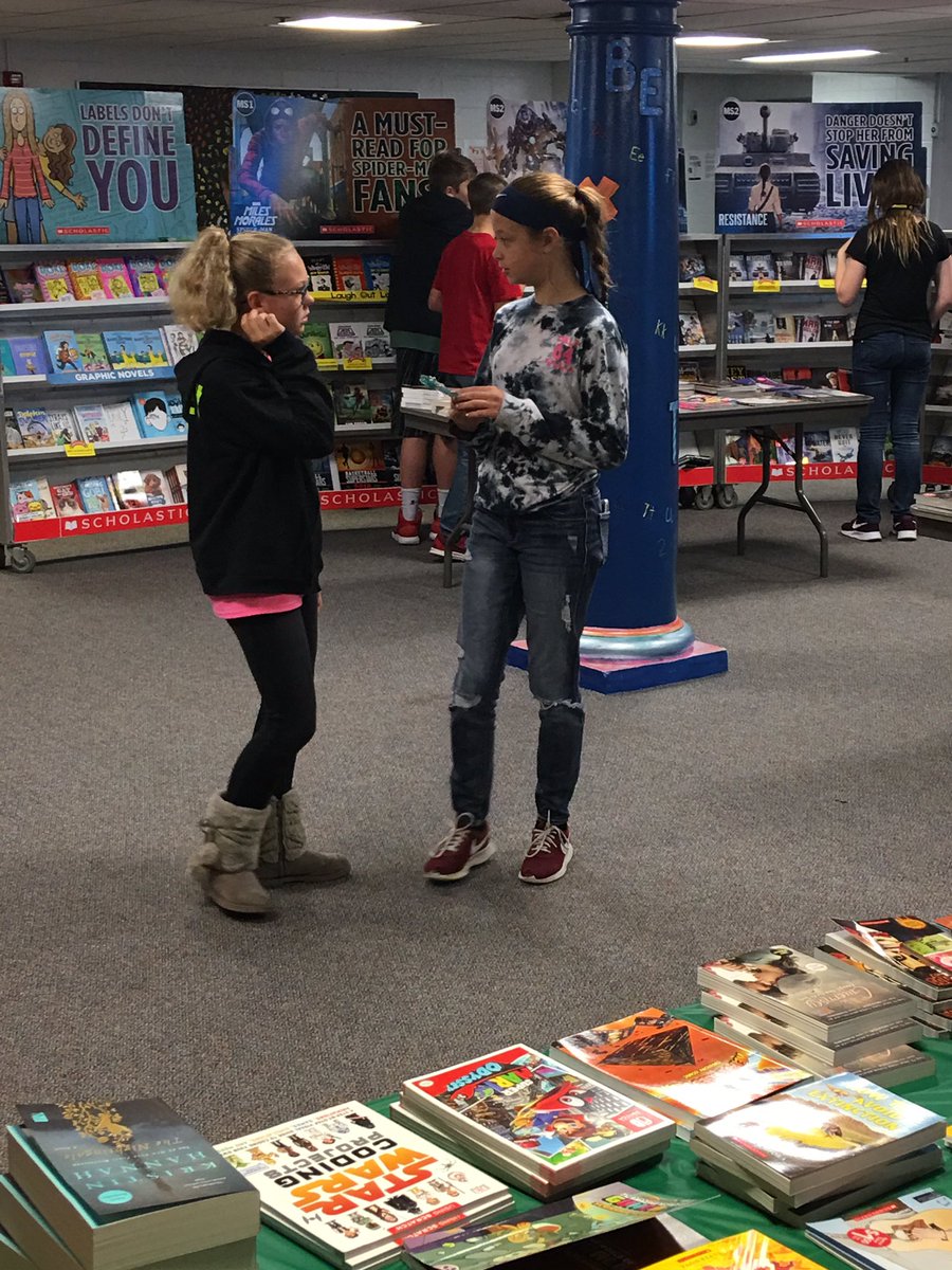 LibraryTitan's tweet photo. The Middle School Book Fair is in full swing!  Make sure to stop by tonight while you’re attending conferences. The proceeds help us purchase new books for the library. https://t.co/nNCyEmC2FG