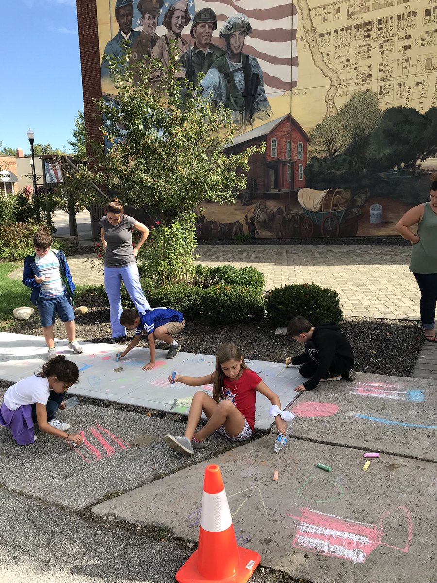 Creating our own mural in front of the Reynoldsburg Community Mural.