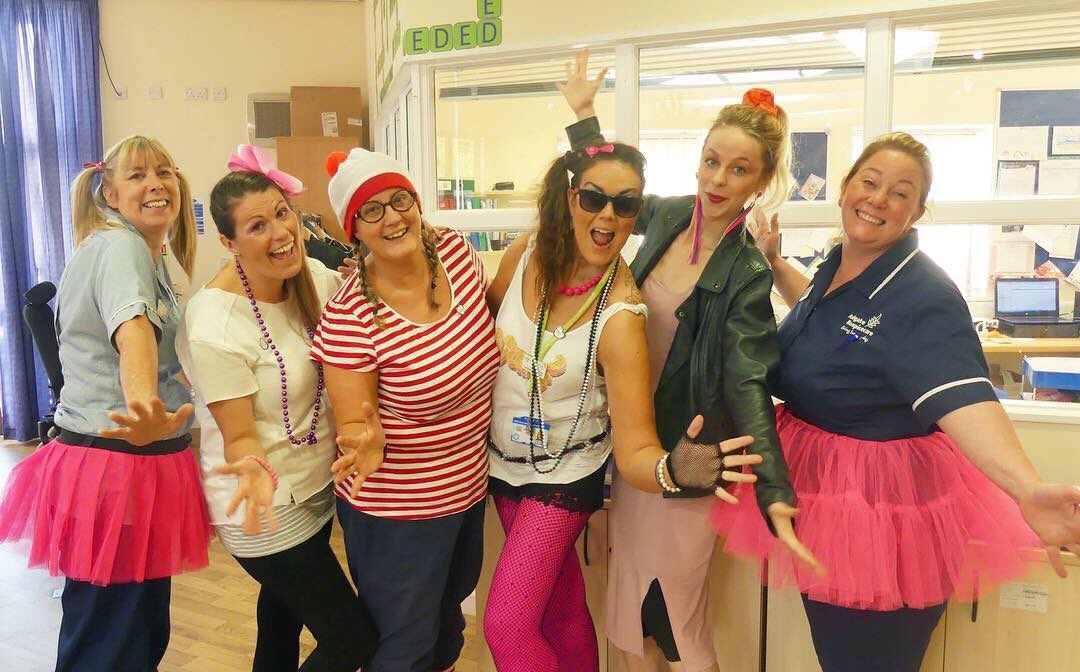 Ashgate_Hospice's tweet photo. Today, our fabulous staff raided their attics and donned their favourite leg warmers and fish nets from the 80s to celebrate 30 years of caring for our community. Donβt they look amazing?! πΈπ #AshgateIs30 https://t.co/x5sfDRHIYA