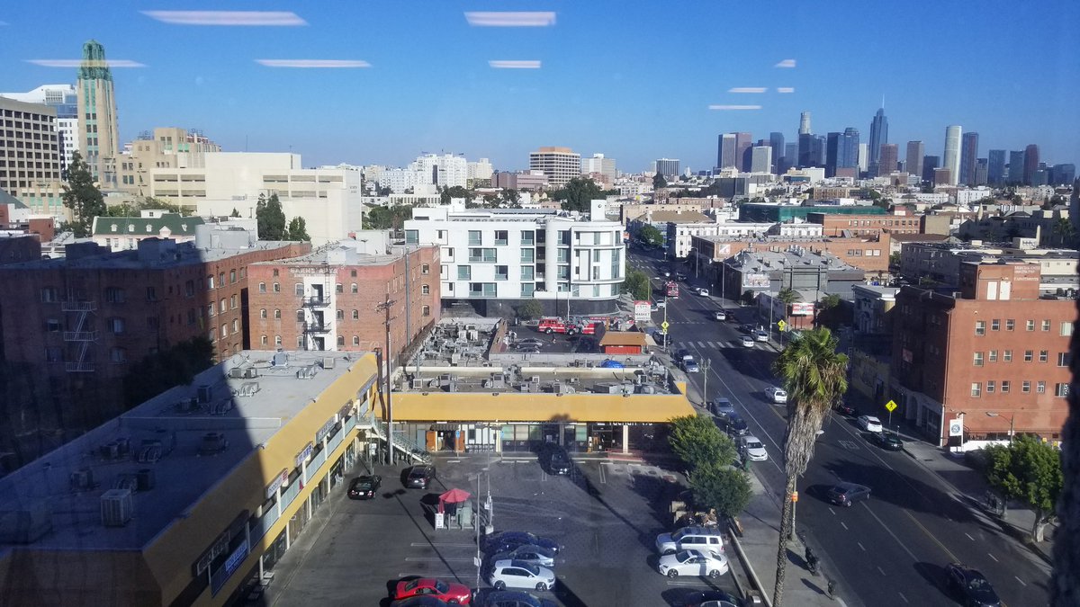 DjMugen's tweet photo. Fire trucks and cop cars blocking the streets with a ghetto bird flying around. What's happening in #koreatown https://t.co/76rTwS2mfW