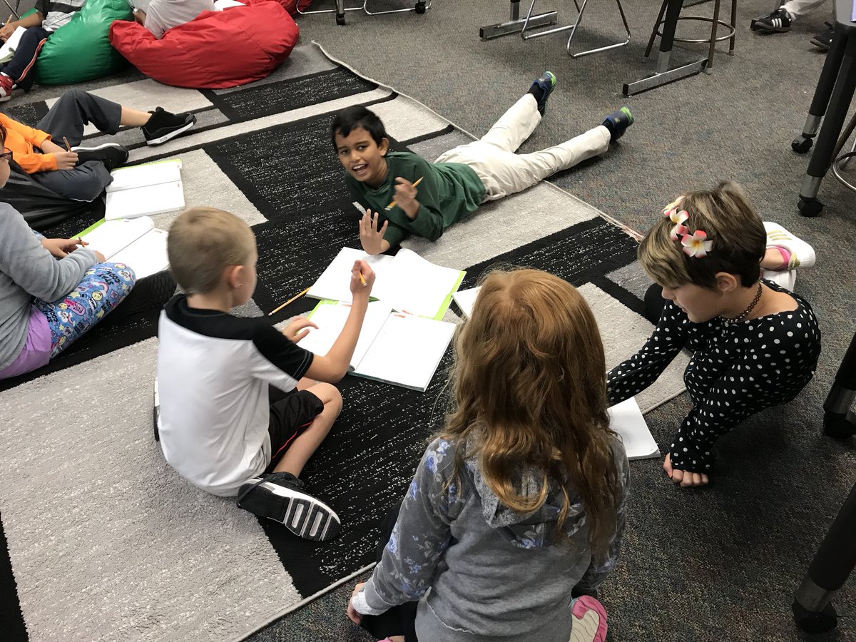 Working in partnerships to solve and explain while reviewing for a math test.