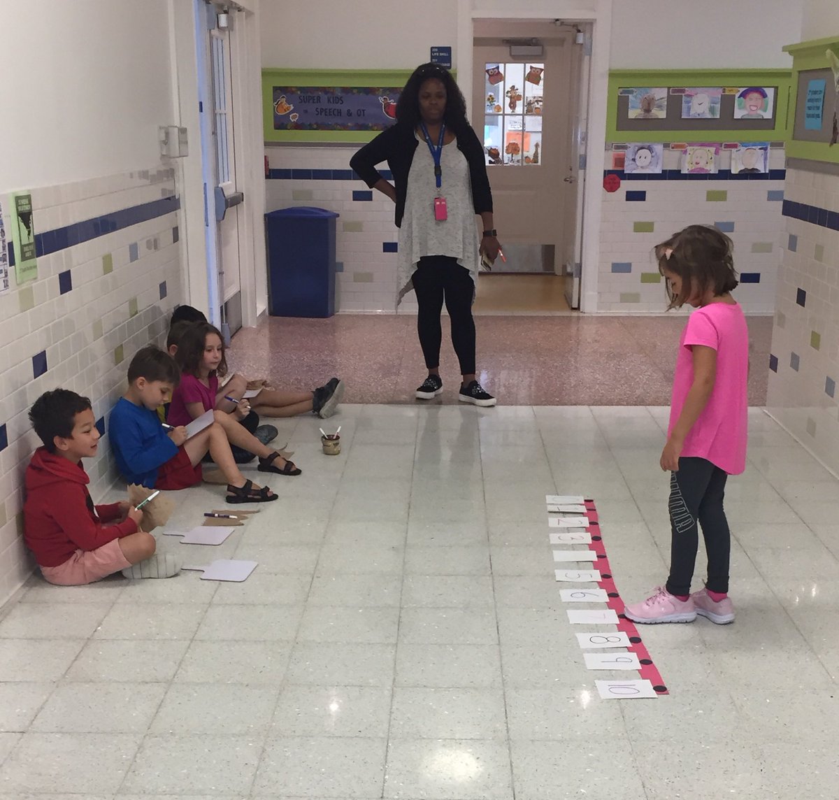 HearstPrincipal's tweet image. As one student uses the number line to show whole-part=part, her classmates write the subtraction equation on their white boards #multiplemodalities #learningoccurseverywhere ⁦@evie_gilmore34⁩ ⁦@hearstes⁩ ⁦@dcpublicschools⁩