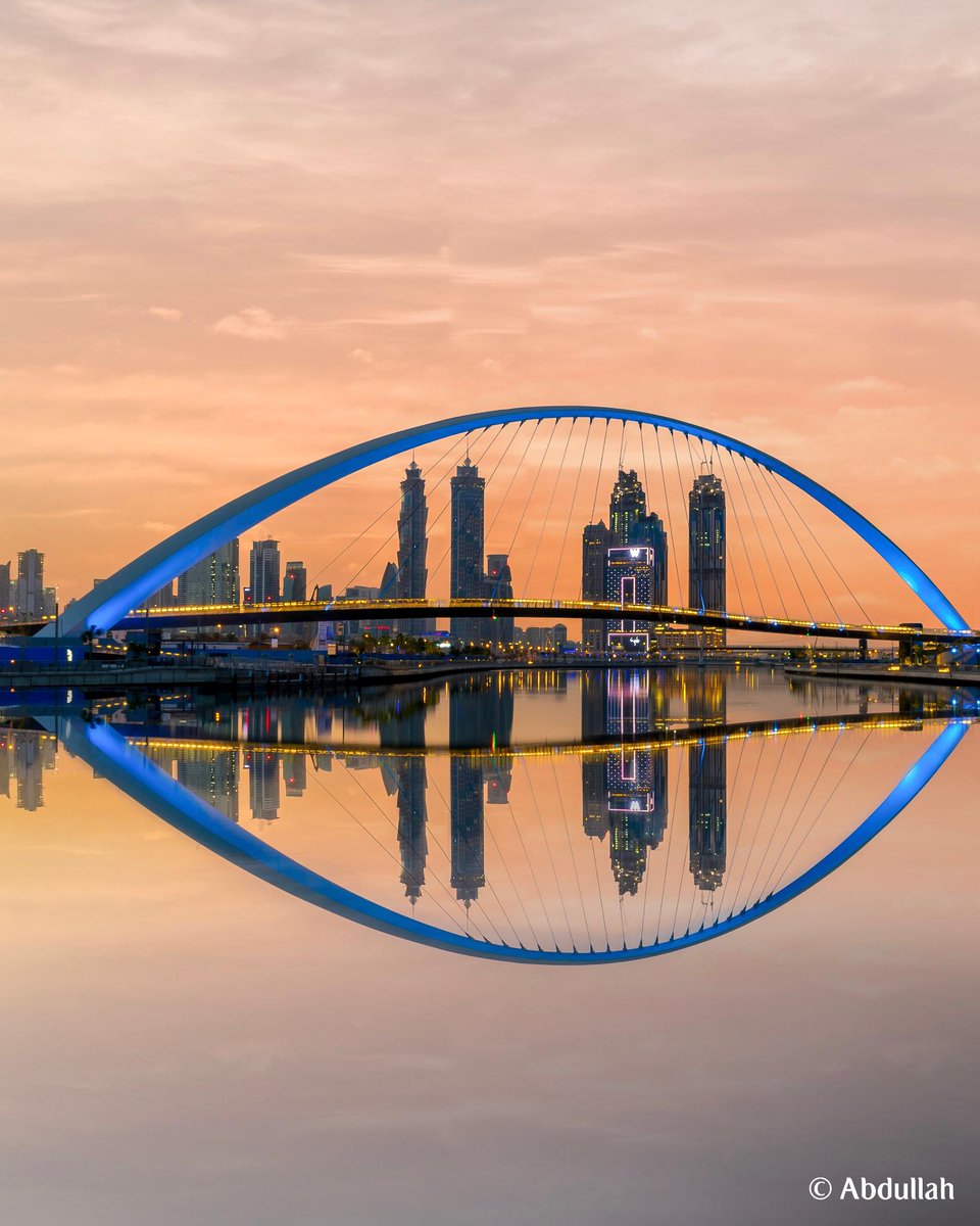 emirates's tweet photo. An iconic gateway that connects Dubai’s rich history to its vibrant future, the Tolerance Bridge over the Dubai Water Canal represents Dubai’s bringing together of people, cultures and ideas from across the world. #MyDubai https://t.co/Em2XFsY6pi