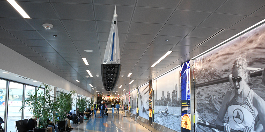 BostonLogan's tweet photo. Can’t make it to @HOCR this year? Experience the race up close with our informational exhibit and racing boats in Terminal B post-security by gates B37-B38. #ExhibitsInBOS https://t.co/cWZ9uGK0HJ