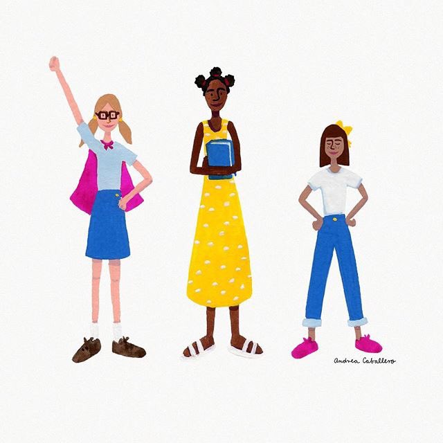 Three girls standing. One girl is posing as a  superwomen, one girl is holding a book, and one girl is standing in a powerful pose.]