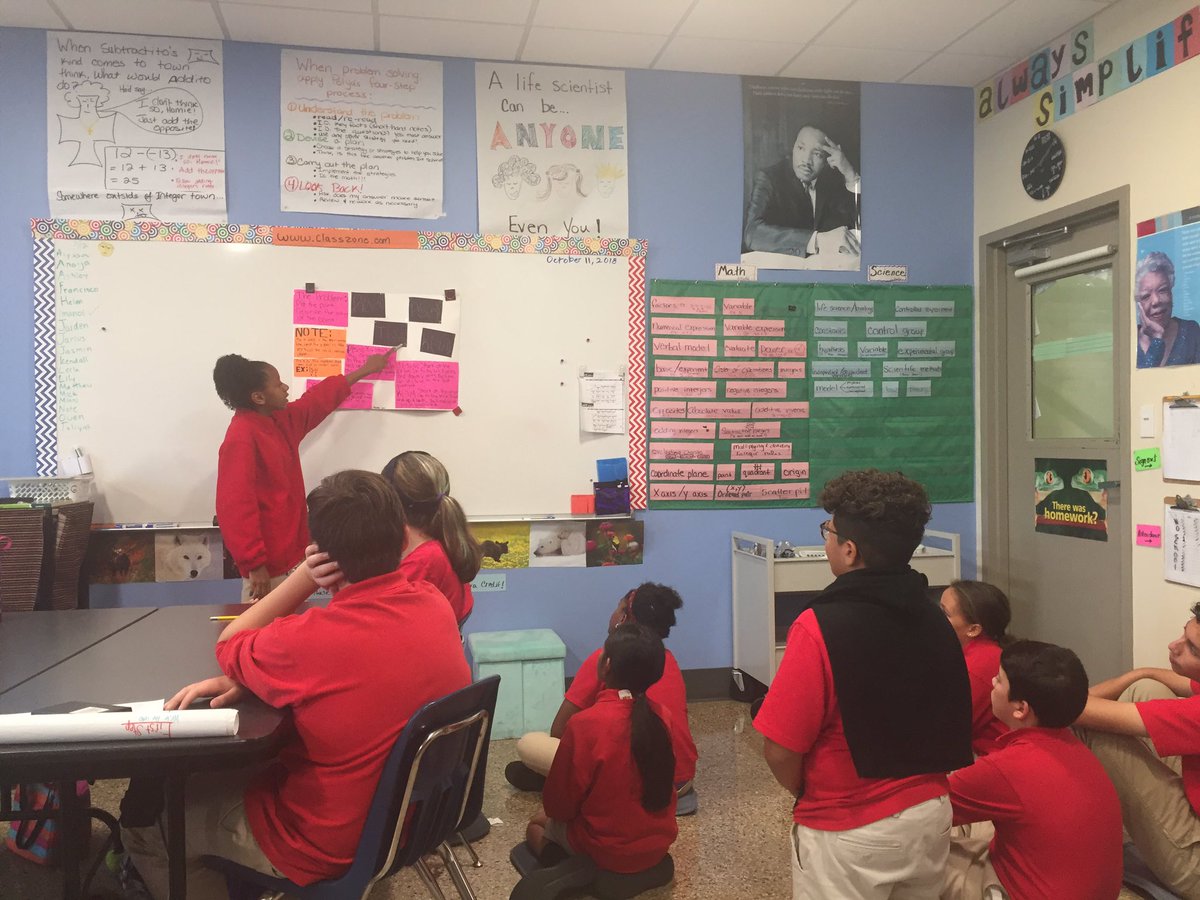principal_CP's tweet image. Kendall teaches the class how to plot points on a coordinate plain.