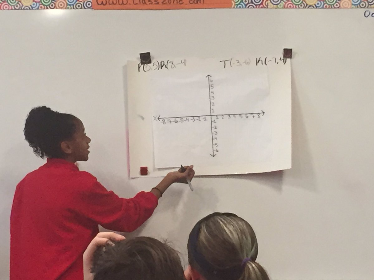 principal_CP's tweet image. Kendall teaches the class how to plot points on a coordinate plain.