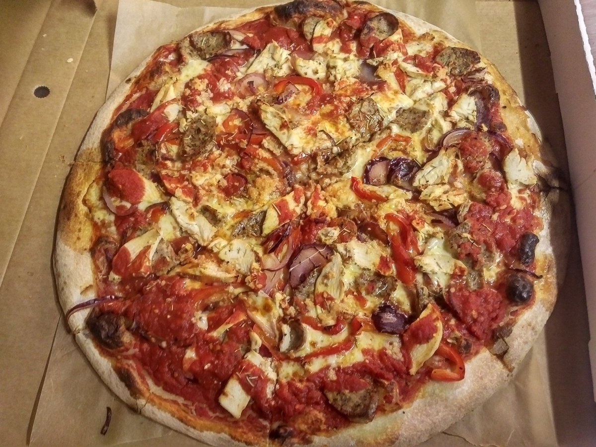 Absolute beast of an 18" New Yorker just left the pizzeria!