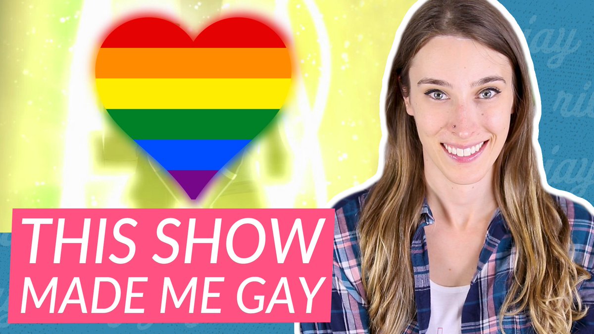 riley on the right, smiling, on the left is a bright yellow image with a rainbow heart over it, below that are the words "this show made me gay"