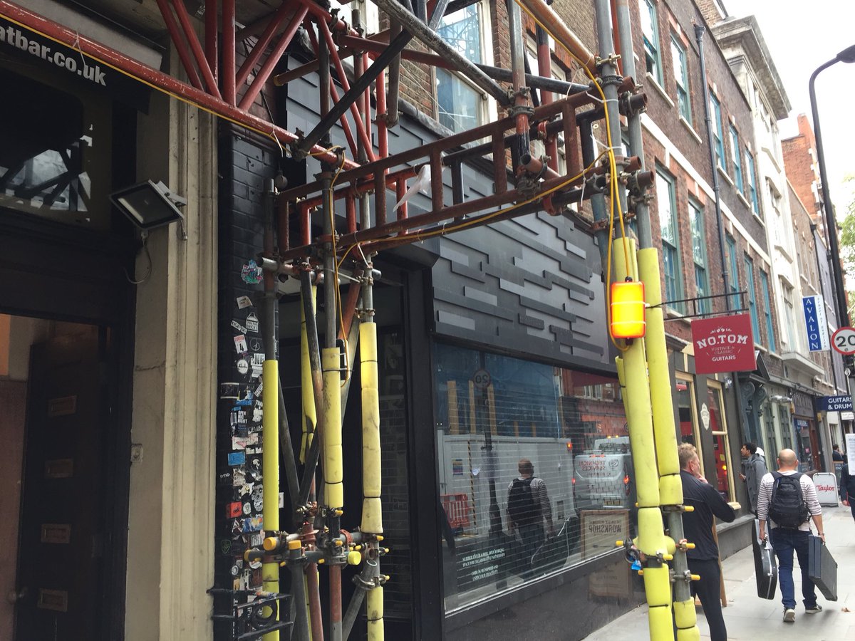 AdamScovell's tweet image. Denmark Street is, to coin a phrase, absolutely fucked. Lots of closed shops and a massive new development between the end cafe and St. Giles in the Field, nevermind the finished horror at the end of the road #SaveSoho