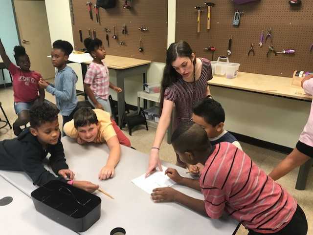 Tech_CoachLloyd's tweet image. Ms. Messex and her students are working hard in the Makerspace.