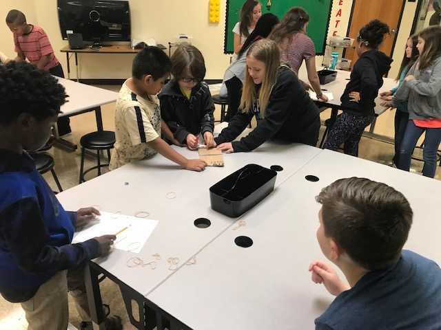 Tech_CoachLloyd's tweet image. Ms. Messex and her students are working hard in the Makerspace.