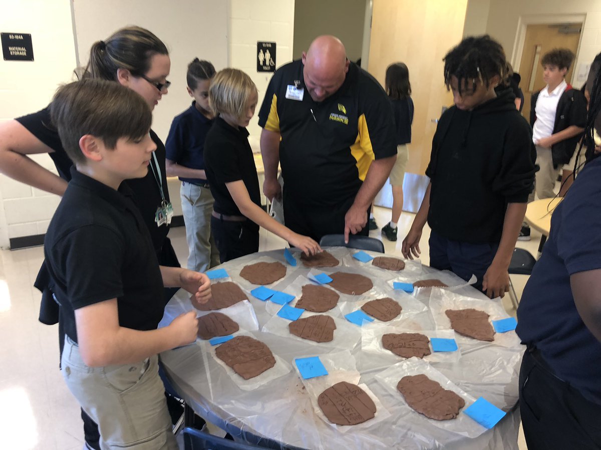 NoraChoquette's tweet photo. Ms. Bonsant’s Social Studies classes are incorporating STEAM in their current history lesson! The kids were soooo excited to explain their Cuneiform creations to us 🍎📜✏️ @HorizonAcadFL @MrsSarahTierney @MCPS_Secondary https://t.co/2ZjNC637Y1