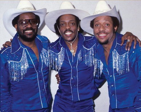 But the thing about the connection of the MOVE bombing and The Gap Band is that there's a deeper connection. The Wilson brothers were known of their unique fashion sense, with many of their outfits being stylized, funky, cowboy outfits