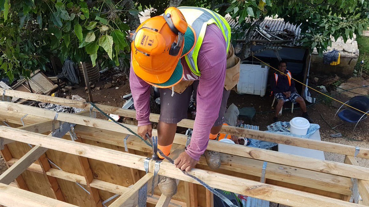 AustHCTonga's tweet photo. Disaster risk reduction is all in a day’s work for Tongan NGO @MORDItonga, who are working with @CAREAustralia and Live and Learn to help make houses across Tonga better able to withstand natural disasters thanks to #AustralianAid #IDDR2018 #ResilienceForAll https://t.co/2wmczfEfC0