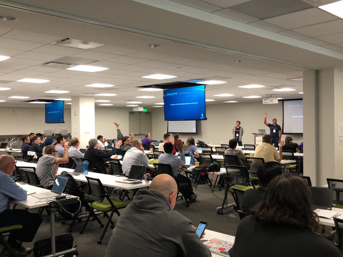 blamelesshq's tweet image. Half of the room has run into the same incident more than once! Blameless co-founders @asharrizqi and @lyonwong doing a talk on #blameless postmortems at #BoSRE. 
#SRE