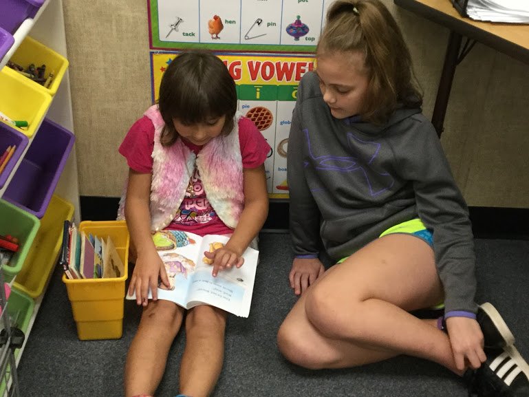 NHWBarry's tweet photo. Yesterday we had special visitors in our classroom! We read to a 6th grade buddy (or two) from @NHWgrade6. These 6th graders were my first group of 1st graders! #allgrownup 😭 https://t.co/hQ8Py6WGkl