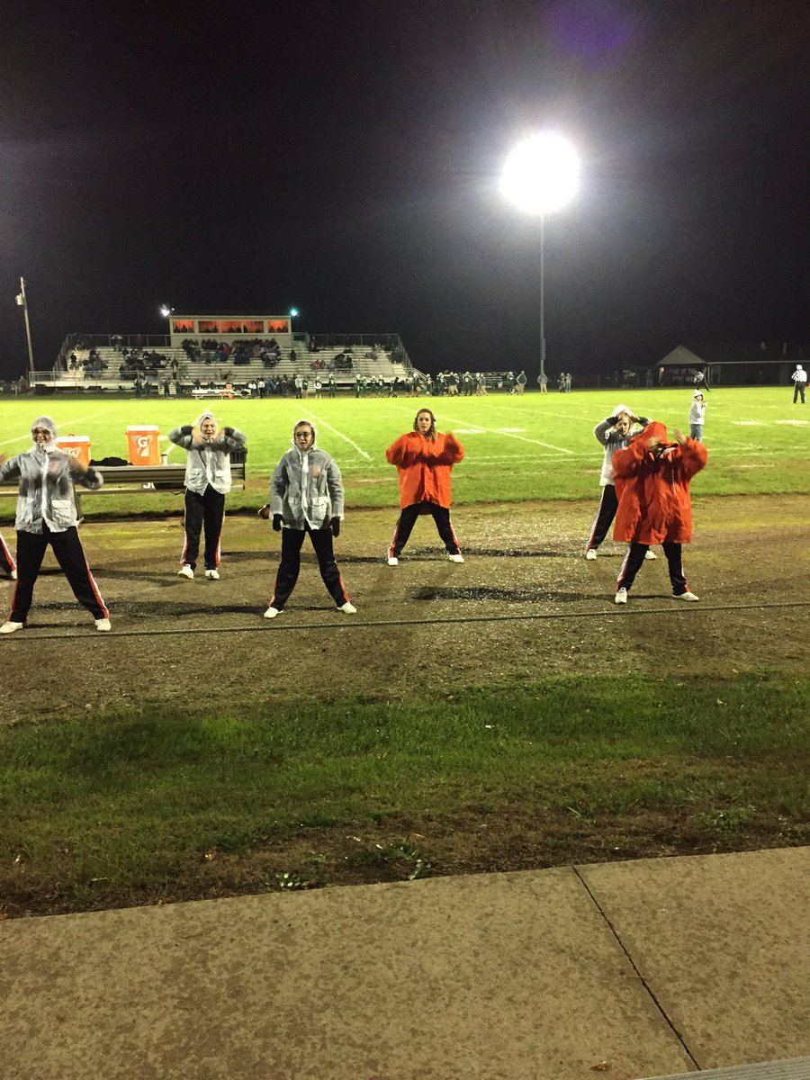 When you forget your rain jacket...Football coat is the next best thing