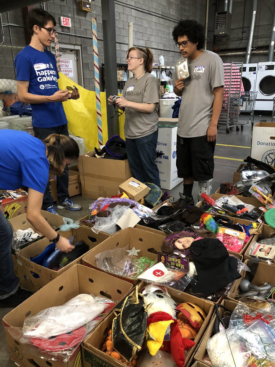 PowerMathCamp's tweet photo. The #GateWayMathClub a good time volunteering with @SVdP! Even though the power went out so we couldn’t make pizzas, we were able to help sort costumes for children in preparation for Halloween! We *may* have tried on a few costumes for size... 😊 https://t.co/jkADzpT3Ar