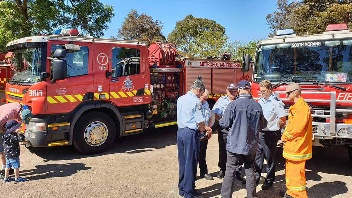 jckresq's tweet photo. Good turnout for a multi-faith, multi-agency blessing of the fleet in Whittlsea today. Personnel and trucks from FFMV, CFA, MFB, SES, AV, POLICE, Council, ACC, EMV and members of the public held a small service to wish us all a safe summer and year ahead. #FireActionWeek https://t.co/RSNXJqdCzj