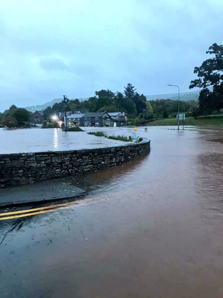 FoDDC_CEO's tweet photo. Crickhowell bridge is in there somewhere! The River Usk is massive at present. Our @powyshighways crews will be extremely busy all day. Be careful out there. Essential travel only!! https://t.co/OgNgwxXCo6
