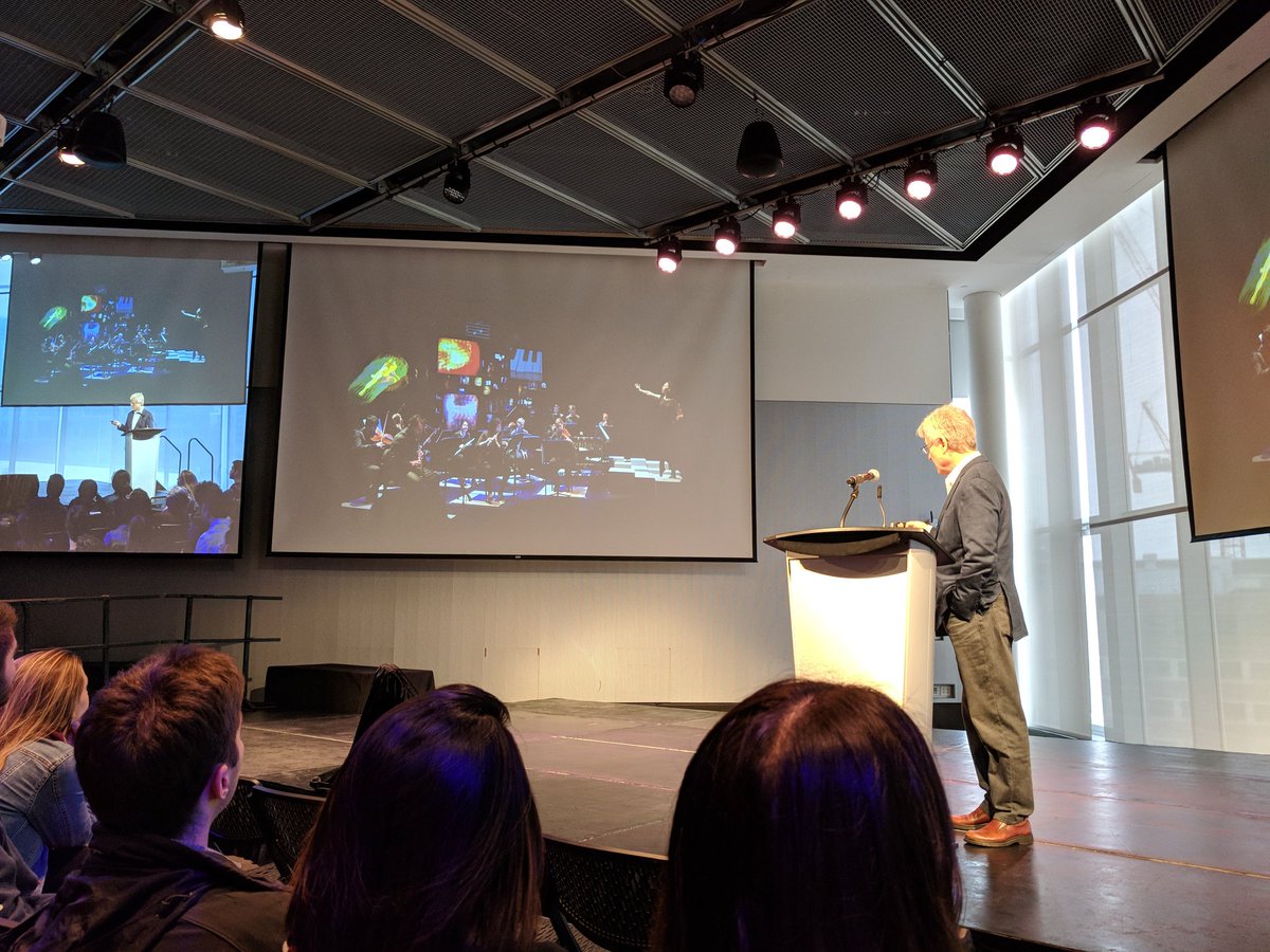 Nerdwiththehat's tweet image. From Juilliard - Terry Riley&apos;s &quot;In C&quot;, an aleatoric piece by ensemble of indeterminate size, dancers, video projection, and game controllers.   #HackingArts2018