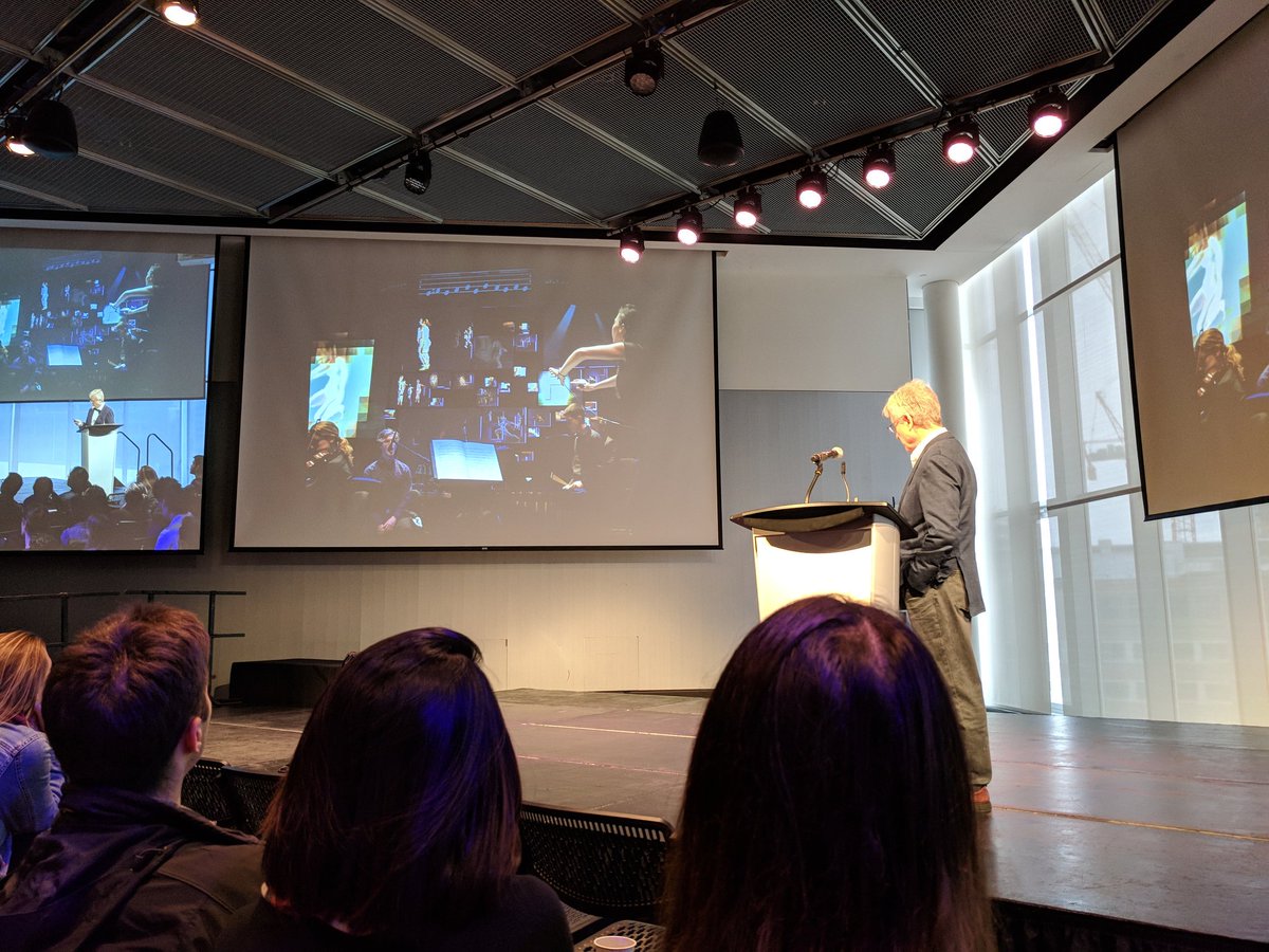 Nerdwiththehat's tweet image. From Juilliard - Terry Riley&apos;s &quot;In C&quot;, an aleatoric piece by ensemble of indeterminate size, dancers, video projection, and game controllers.   #HackingArts2018