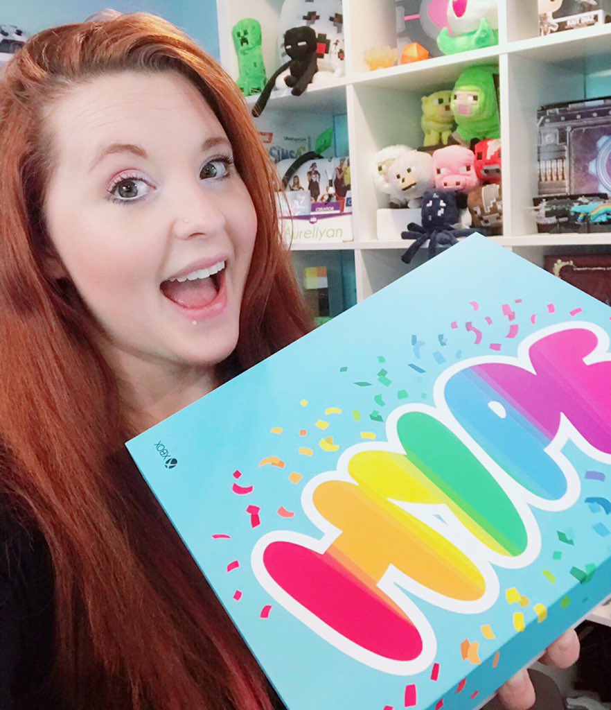 Aureylian with a custom teal Xbox with the aureyHYPE emote on it, lots of rainbows and colors and yay!