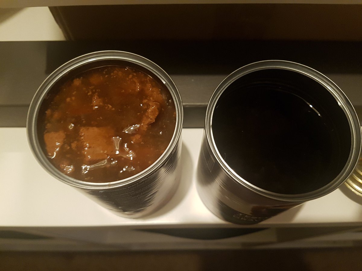 SarahJGearing's tweet photo. @Tesco not sure what happened here but I can't give this to my dog. Put another can next to it so you can clearly see something wrong? Just a dark liquid substance? https://t.co/MoPO0yHjOw