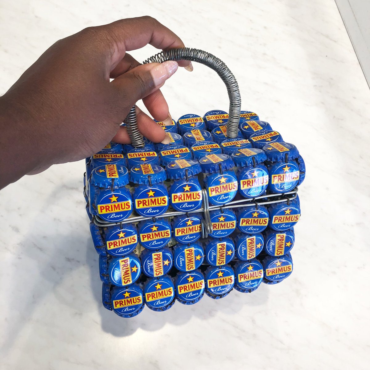 CandaseChambers's tweet photo. Love my #PrimusBeer Bottle Cap bag! 💙 My brought this for me from #Kigali, the capital city of #Rwanda 🇷🇼 https://t.co/bu2Z0ADC62