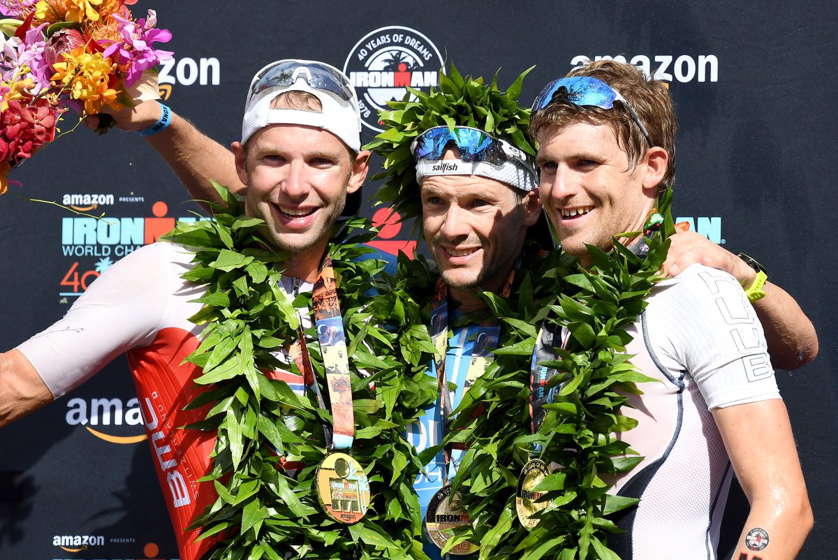 IRONMANtri's tweet photo. Congratulations to the Men’s Podium of the 2018 IRONMAN World Championship brought to you by Amazon! #IMWC 🌿🏆
🥇 @PatrickLange1 7:52:39
🥈 @bartaernouts 7:56:41
🥉 @DavidMcNameetri 8:01:09 https://t.co/QKHO8aLAHV