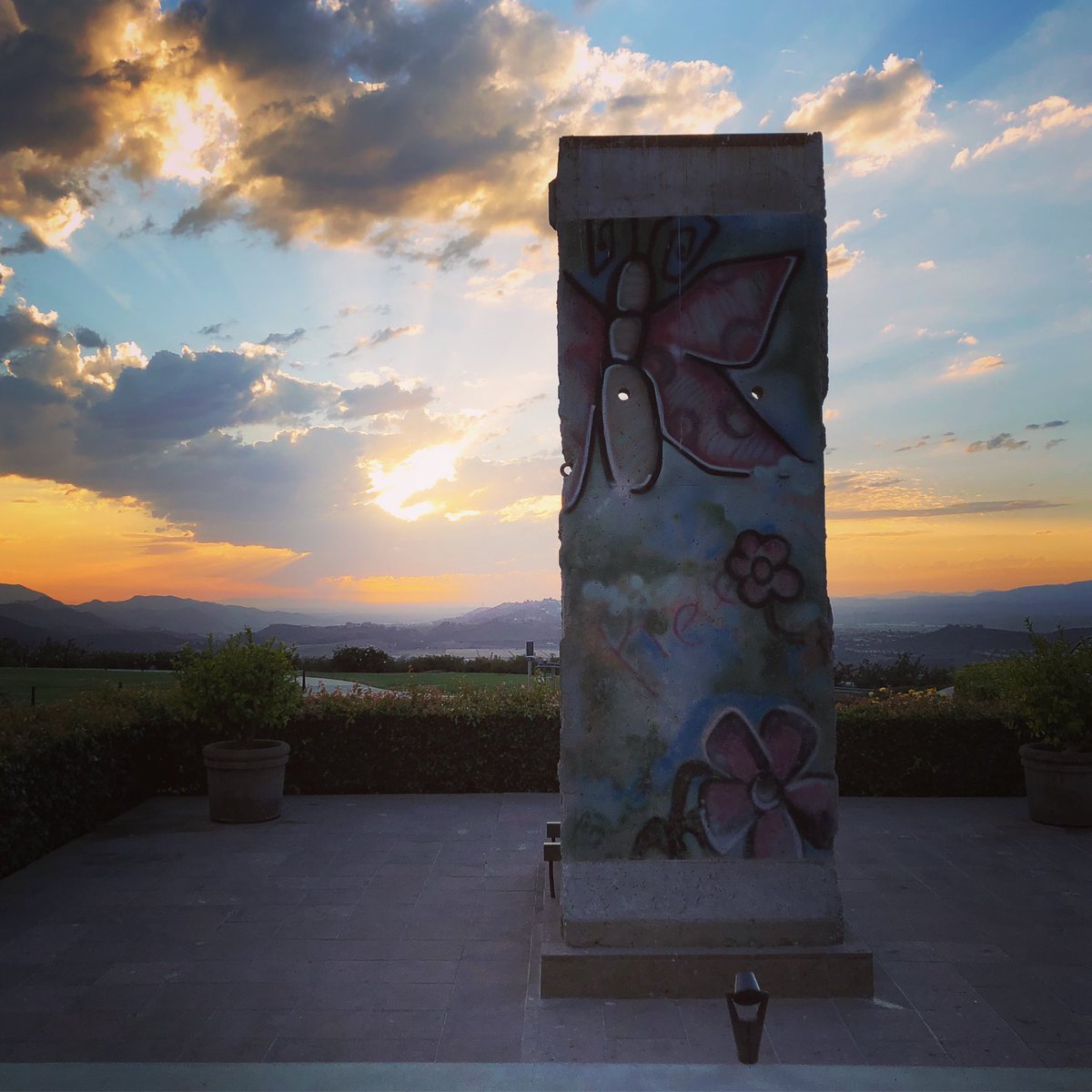 PoliticraftGame's tweet photo. Huge thanks to @ReaganEducation for having us at this years Youth Leadership Summit, and congratulations on a wonderful event! It turns out a piece of the Berlin Wall is more interesting and beautiful at sunset! #RSL2018 #gamethesystem https://t.co/ybUvUpta4x
