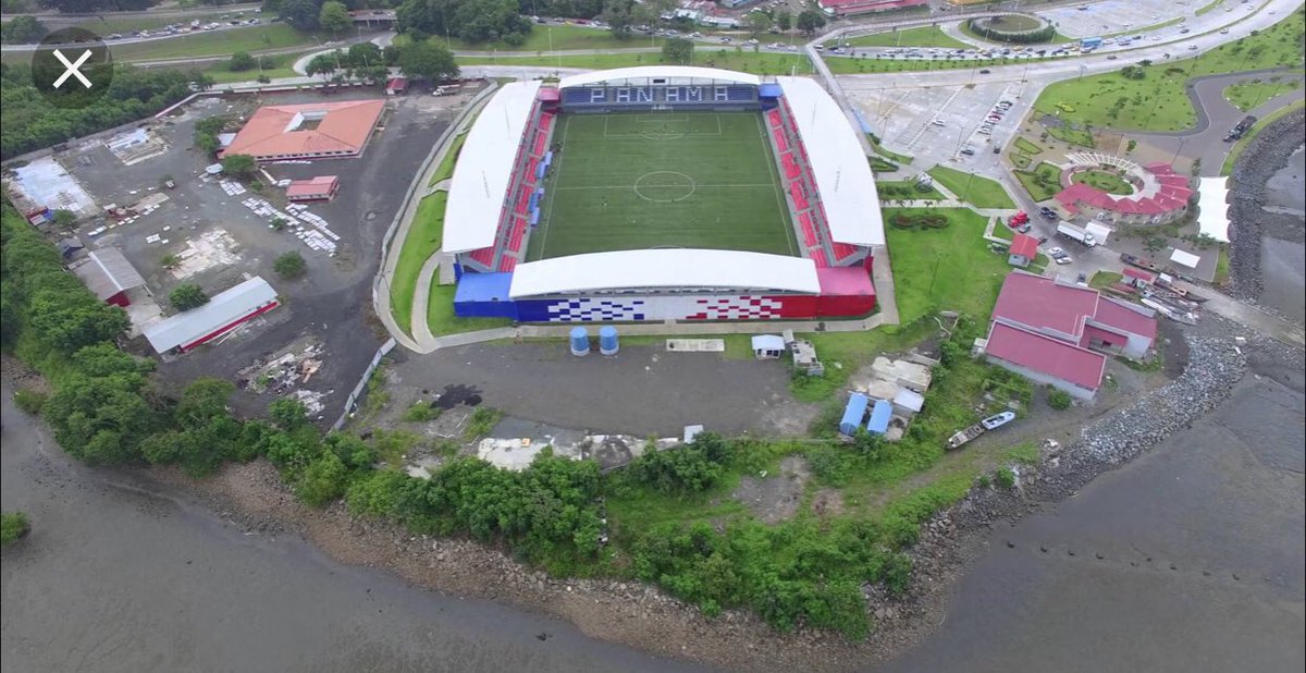 How about the Estádio Maracana in Panama. 5,500 capacity and includes a two tier stand with corporate boxes