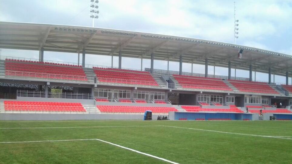 How about the Estádio Maracana in Panama. 5,500 capacity and includes a two tier stand with corporate boxes
