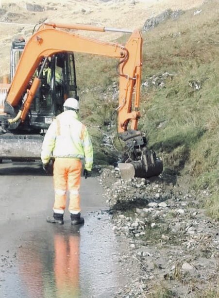 NWTrunkRoads's tweet photo. Recovery of drainage ditches on-going at the #A83 #RabTh on the Old Military Road following secondary landslides. https://t.co/7TSWDYLtnB