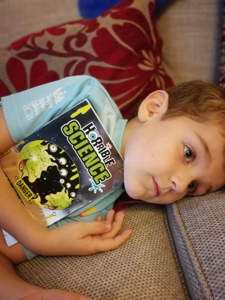 Joffff's tweet photo. @VivacityLibrary @literacy_trust Thanks for bringing @nickarnoldtweet to @PboroSTEMFest yesterday and for inspiring this little future (maybe!) scientist. He's not let go of his signed book since! #psf18 https://t.co/ZFVGrsvLsw