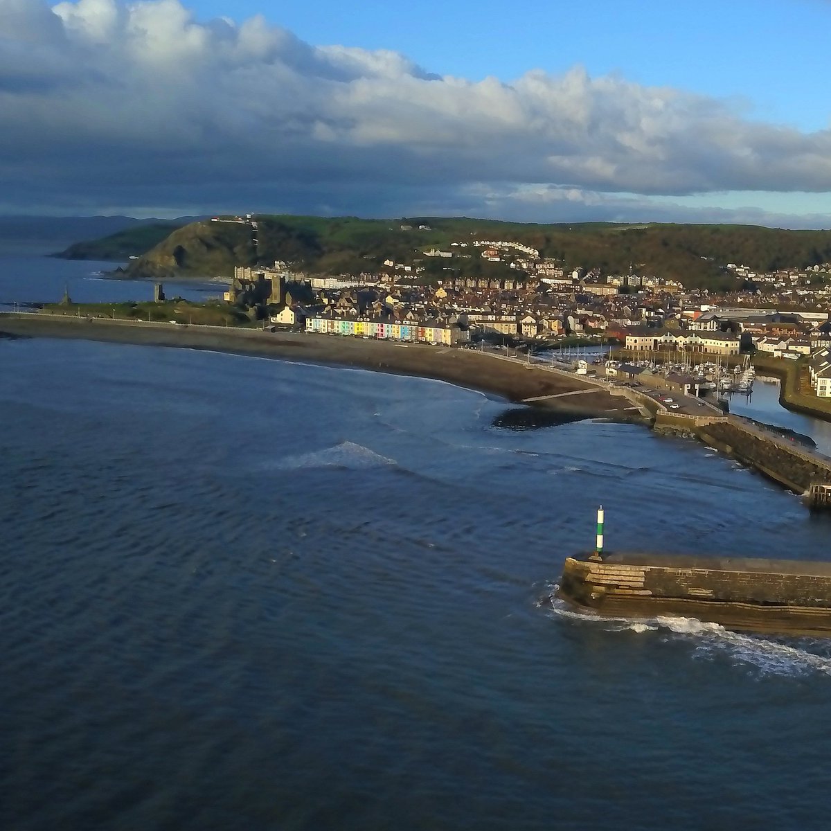 Aberystwyth this evening. Such a contrast to the yesterday's Storm Callum.

#StormCallum #aberystwyth #Wales #harbour #lighthouse #sea #waves #beach #town #djiinspire1 #dronephotographer