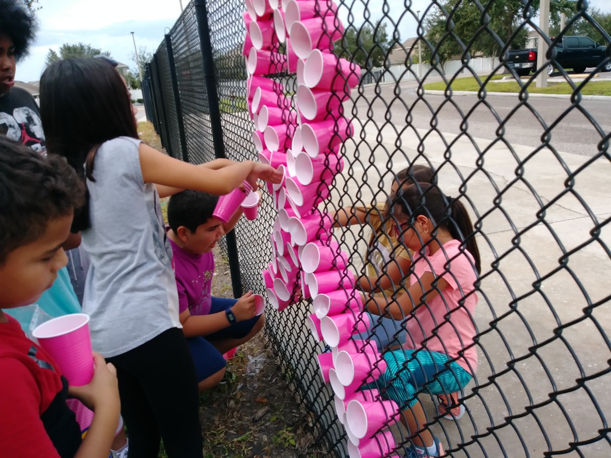 WLES_OCPS's tweet photo. The National Elementary Honor Society students doing their part in bringing breast cancer awareness to our school community. Stop by the front office, we are selling pink bracelets and pink ribbon pins for $1. #NEHS #BreastCancerAwareness #SupporttheCure https://t.co/qZJ2F8zHil