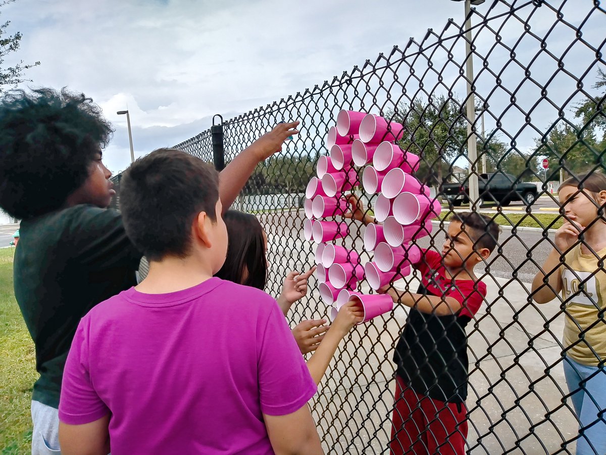 WLES_OCPS's tweet photo. The National Elementary Honor Society students doing their part in bringing breast cancer awareness to our school community. Stop by the front office, we are selling pink bracelets and pink ribbon pins for $1. #NEHS #BreastCancerAwareness #SupporttheCure https://t.co/qZJ2F8zHil