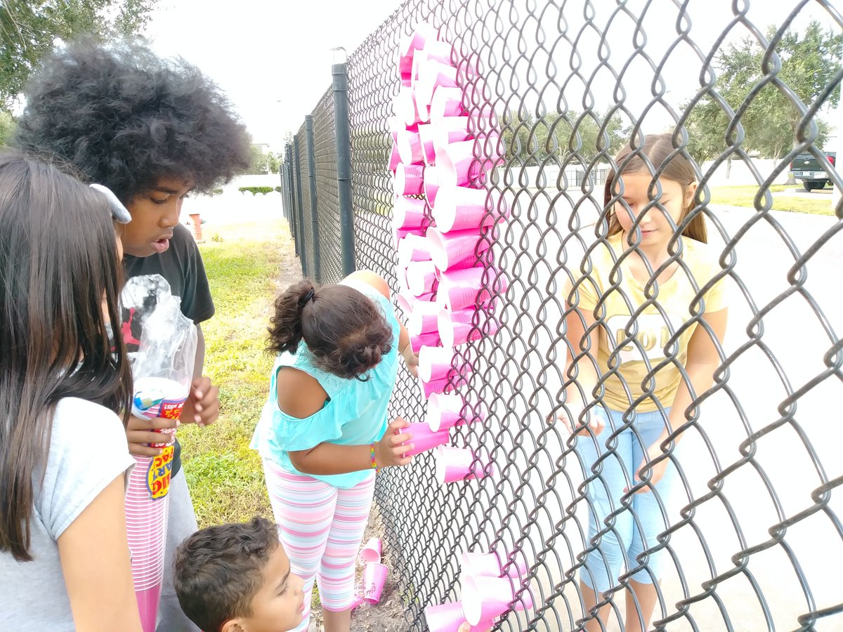 WLES_OCPS's tweet photo. The National Elementary Honor Society students doing their part in bringing breast cancer awareness to our school community. Stop by the front office, we are selling pink bracelets and pink ribbon pins for $1. #NEHS #BreastCancerAwareness #SupporttheCure https://t.co/qZJ2F8zHil