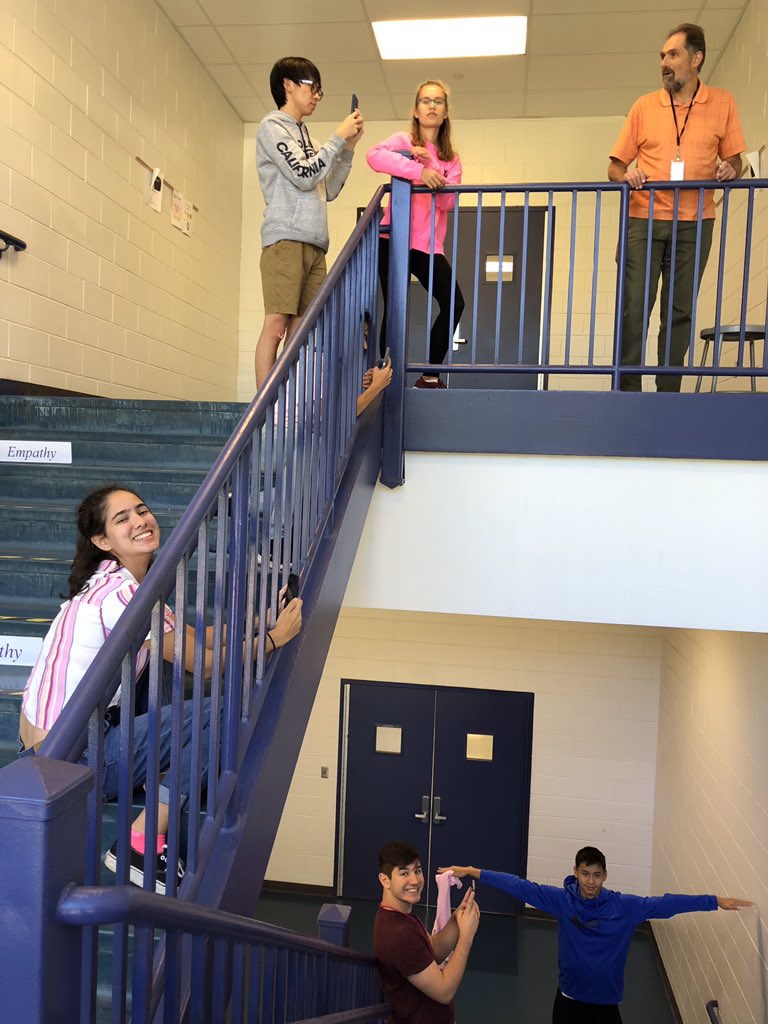 obphysicsclub's tweet photo. dropping a steel and ping pong ball to study air resistance. each student films the drop in slow motion at different increments of the marked wall (we will never tell u how we marked it.) evan’s doing a nice t-pose and nina’s on the ground behind nick filming the point of impact https://t.co/glC3DqBXtK