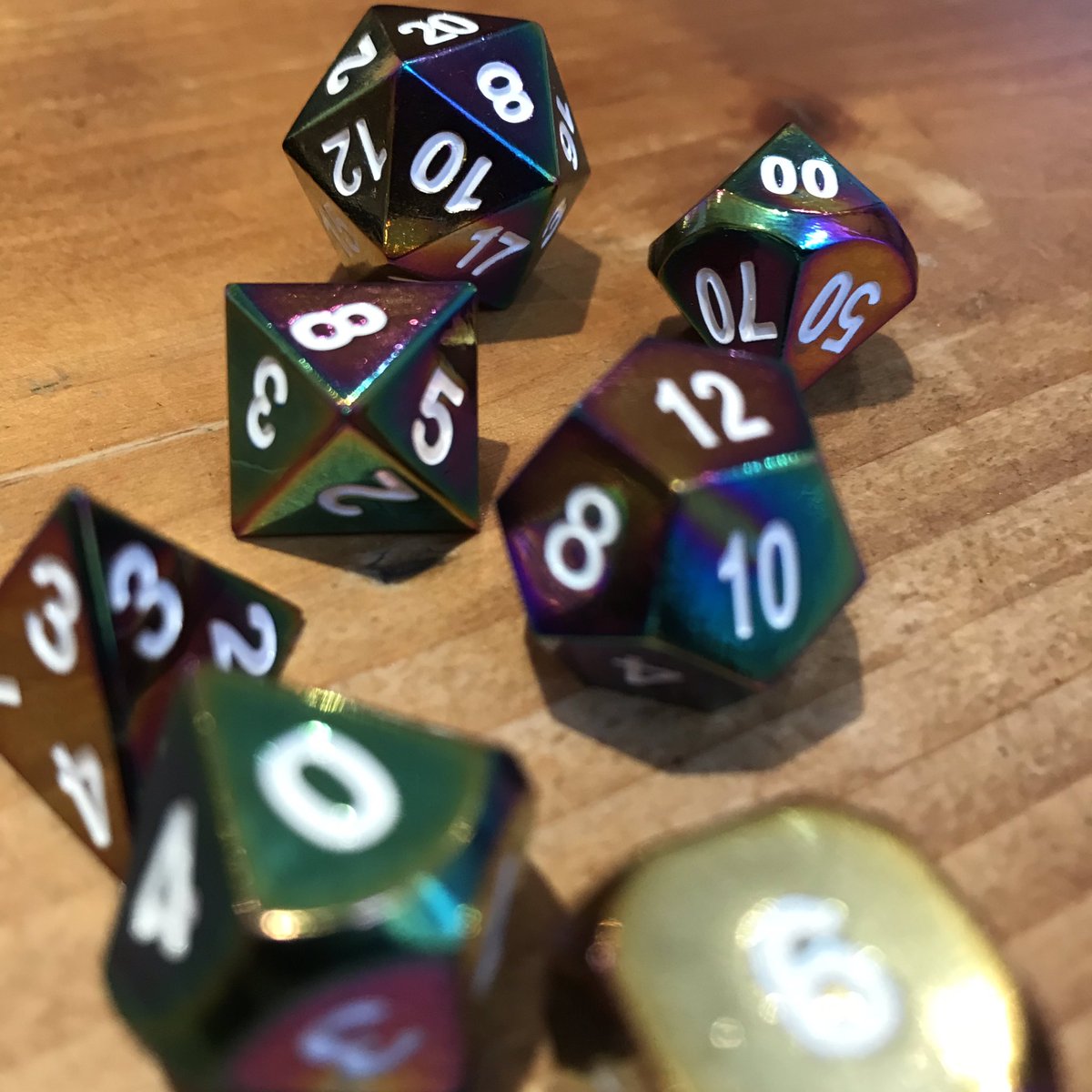 Questingtime's tweet photo. COMPETITION TIME!
In no more than one tweet, pitch me new #MinorMagicItems with that hashtag!
Nothing too powerful (think uncommon in DMG terms), nothing too ‘rulesy’.
The three favourites will show up in a future show and the winner gets this rad rainbow metal dice set! https://t.co/XzMiNQrHSz