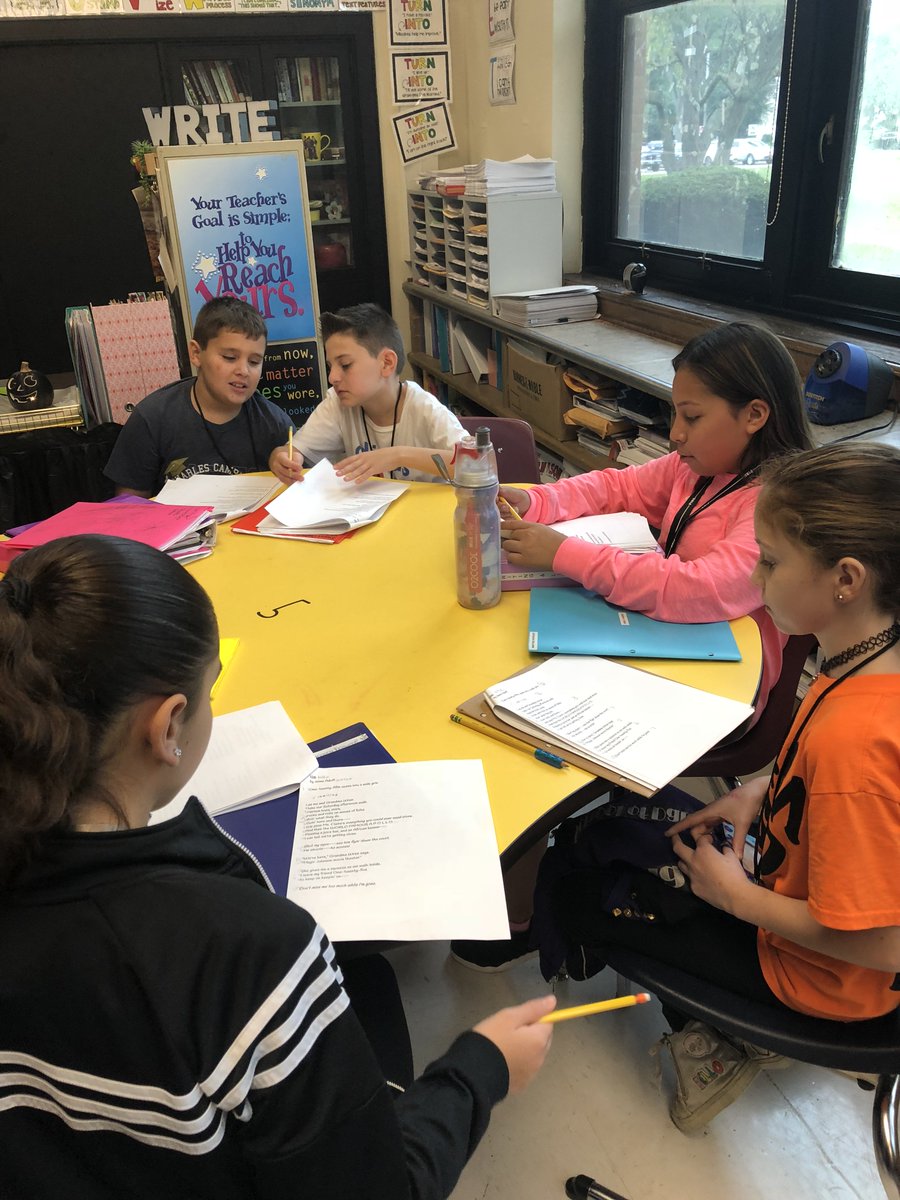 MsGisWRITEhere's tweet photo. How do our growing writers analyze poetry? They SLAM 'em, looking for structure, language, affect, and meaning! Here are our students, partnered up, slammin' a poem of their choice during the close-out of Immersion! https://t.co/QnNLK7aN6e