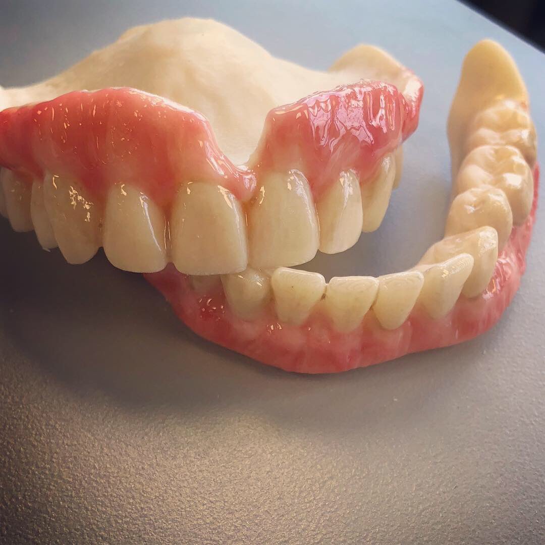 Carson working on gingival toning a printed set of dentures! #digitaldentures #dentures #dental #gingivaltoning #teeth
